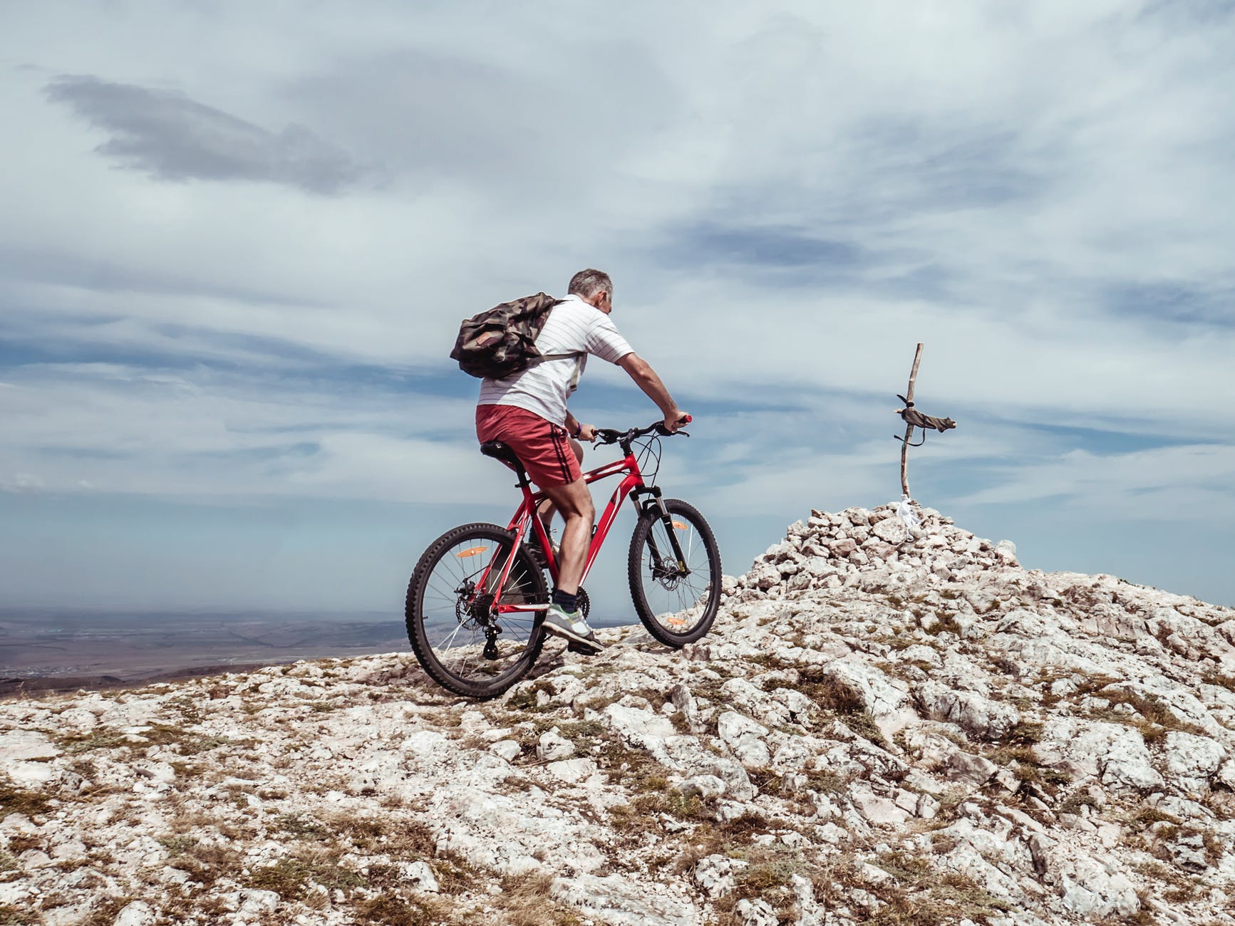 man riding bicycle on off road