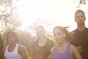 happy diverse sportspeople jogging in park