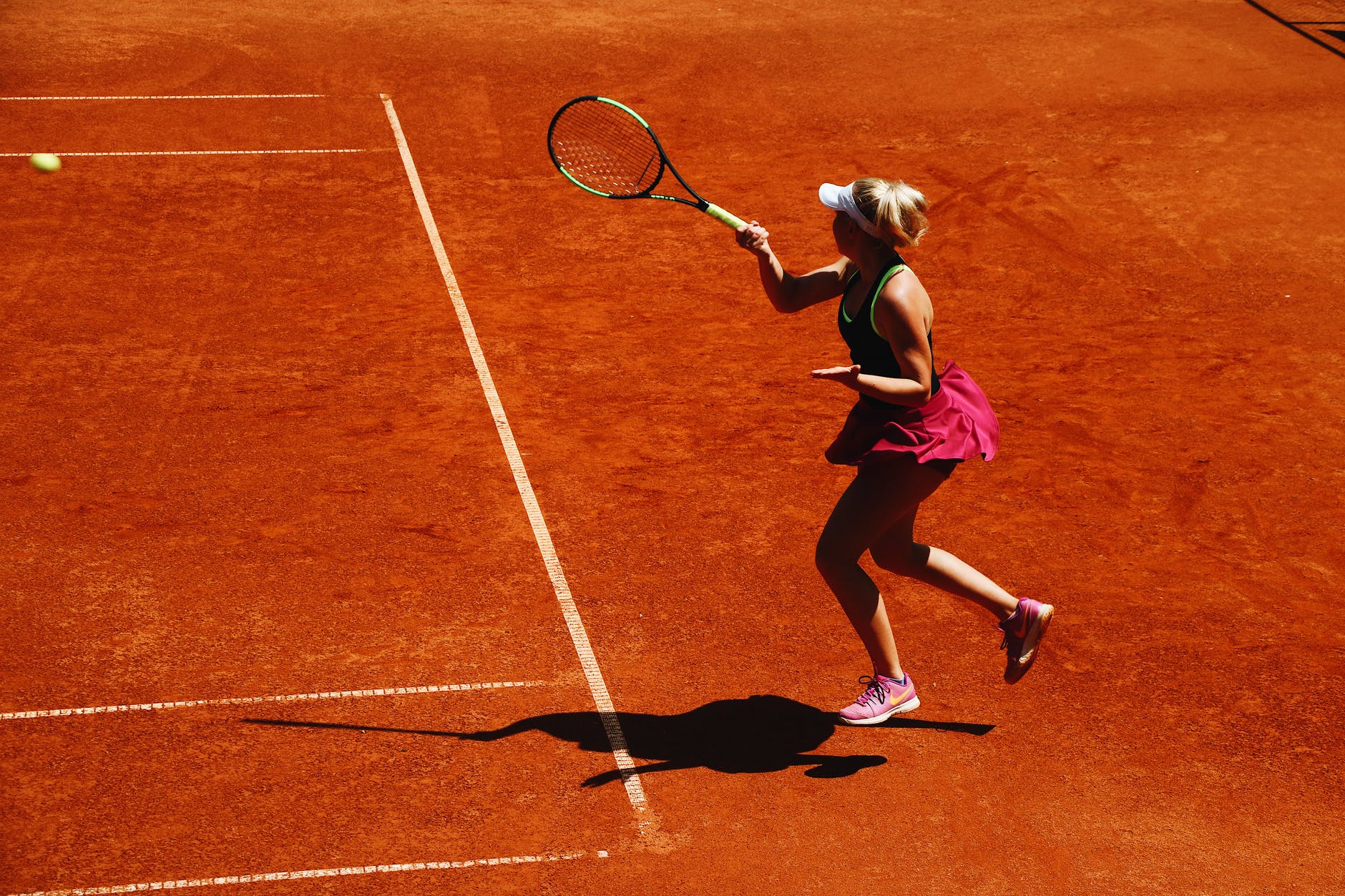 woman playing tennis on court