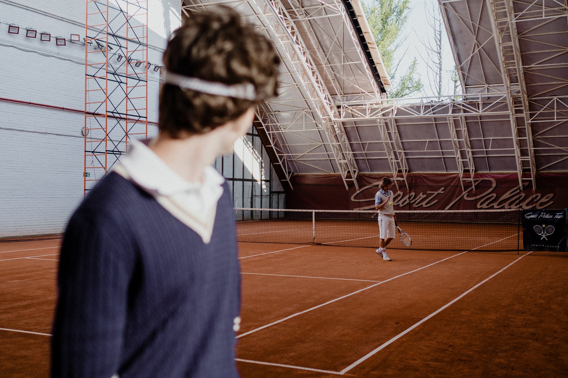 a man standing on the tennis court