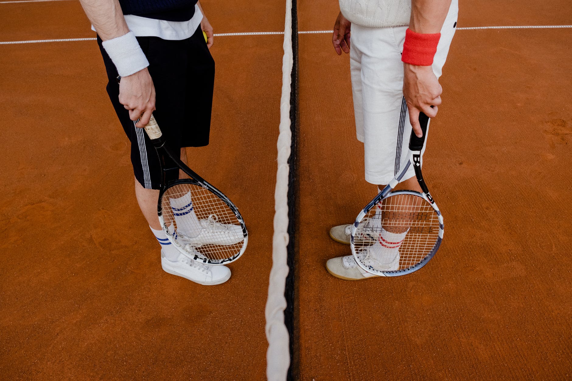 people holding tennis rackets